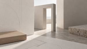 Composizione di volumi architettonici chiari, disegni e campioni di legno e pietra illuminati dalla luce naturale.